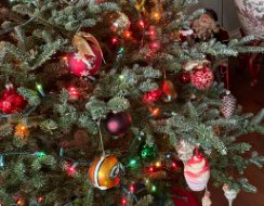 A decorated Christmas tree with glass ornaments