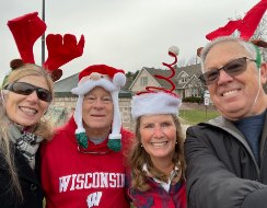 Neighbors in reindeer antlers and Santa hats at a Thornberry Creek entrance